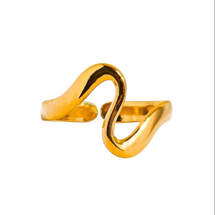 A polished gold-tone open wrap ring with a fluid, wavy S-shaped design, shown on a plain white background.