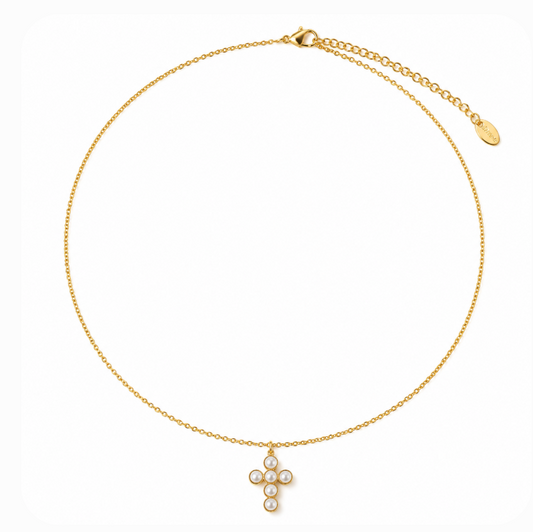 A delicate gold chain necklace with a small cross pendant adorned with white pearls, displayed on a clean white background.