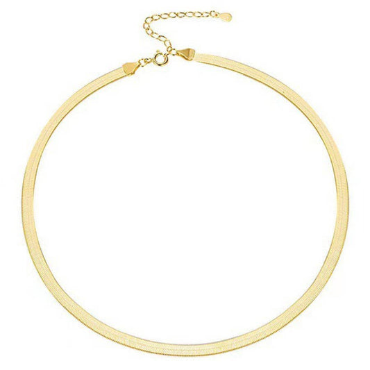 gold herringbone necklace on white background