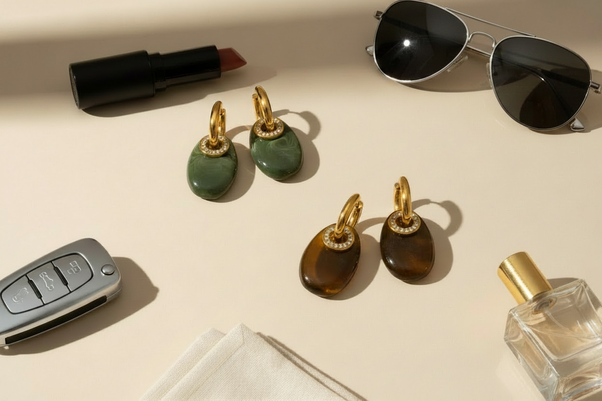 Maia Earrings flat lay with aviator sunglasses